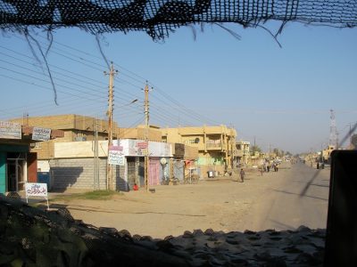 Peeking through to a dirt covered road