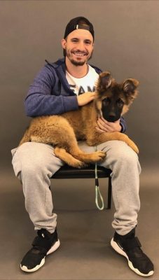 Man with dog sitting on his lap